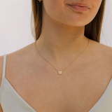 Birthflower necklace gold around neck 