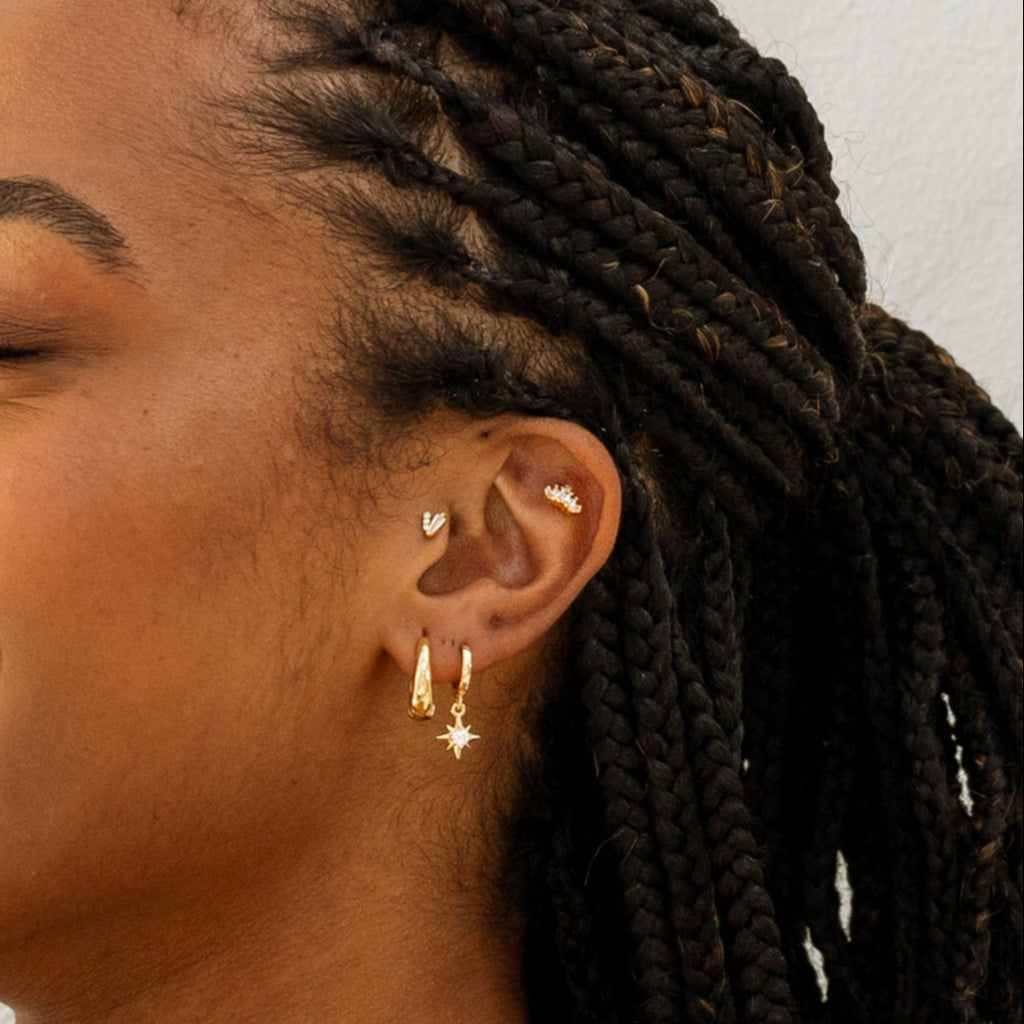 Model wearing Starry Night Barbell Earring in Gold.