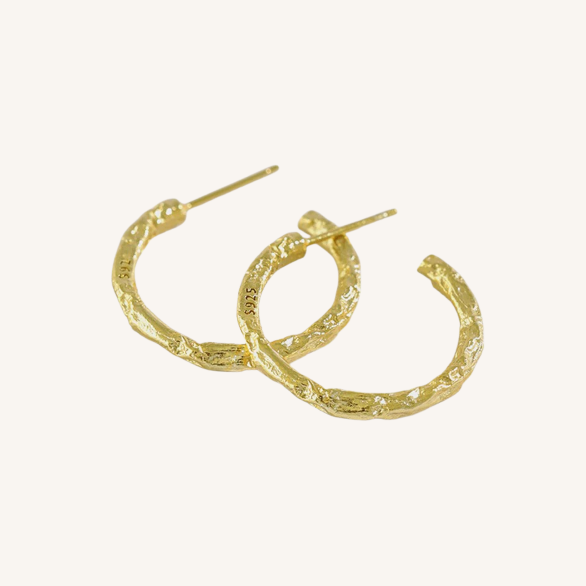 Gold hoop earrings on a white background