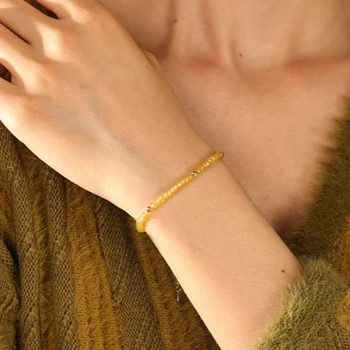 model wearing Harmony Bracelet in yellow