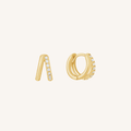 Gold hoop earrings with embedded stones on a white background