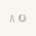 Pair of silver hoop earrings with small stones on a white background