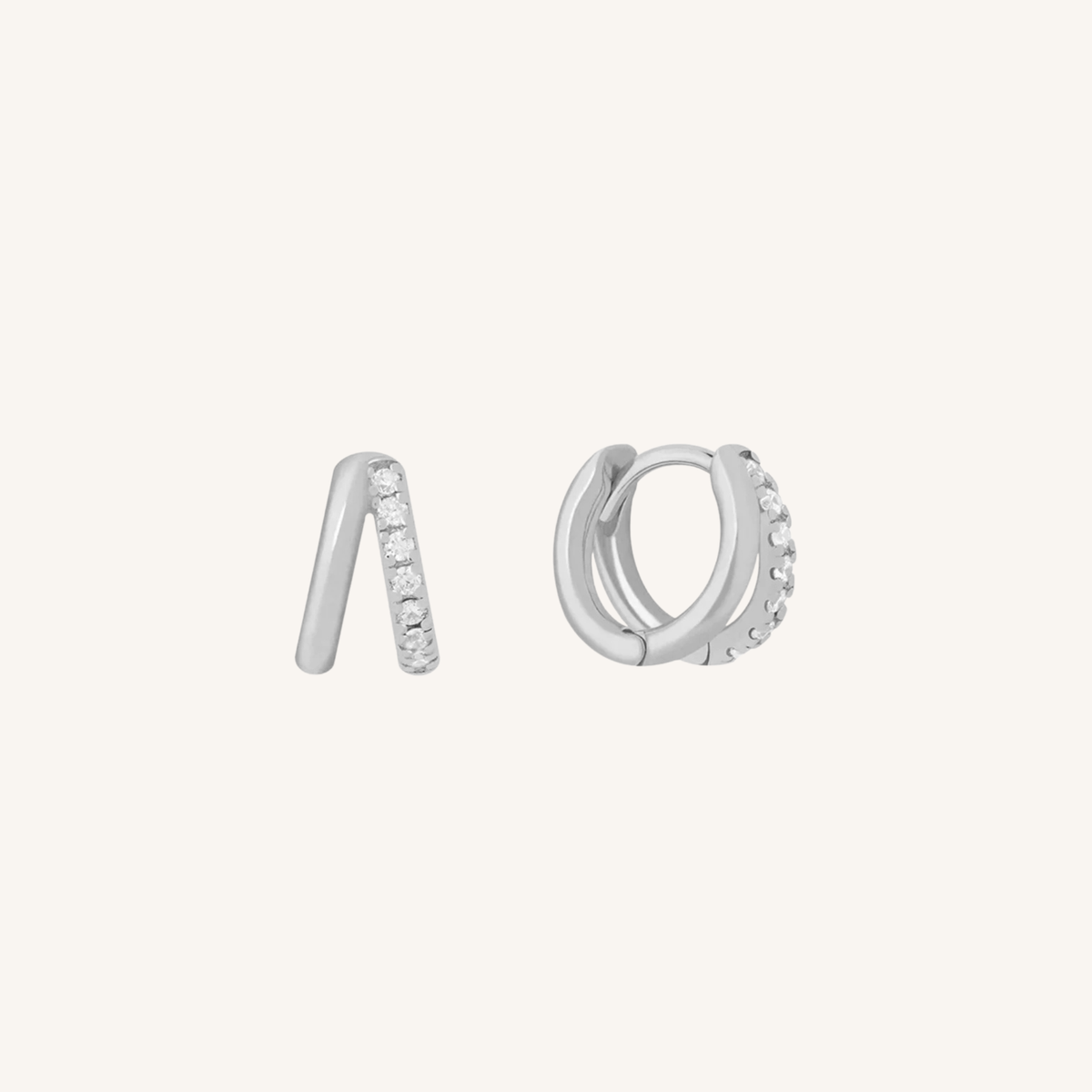 Pair of silver hoop earrings with small stones on a white background