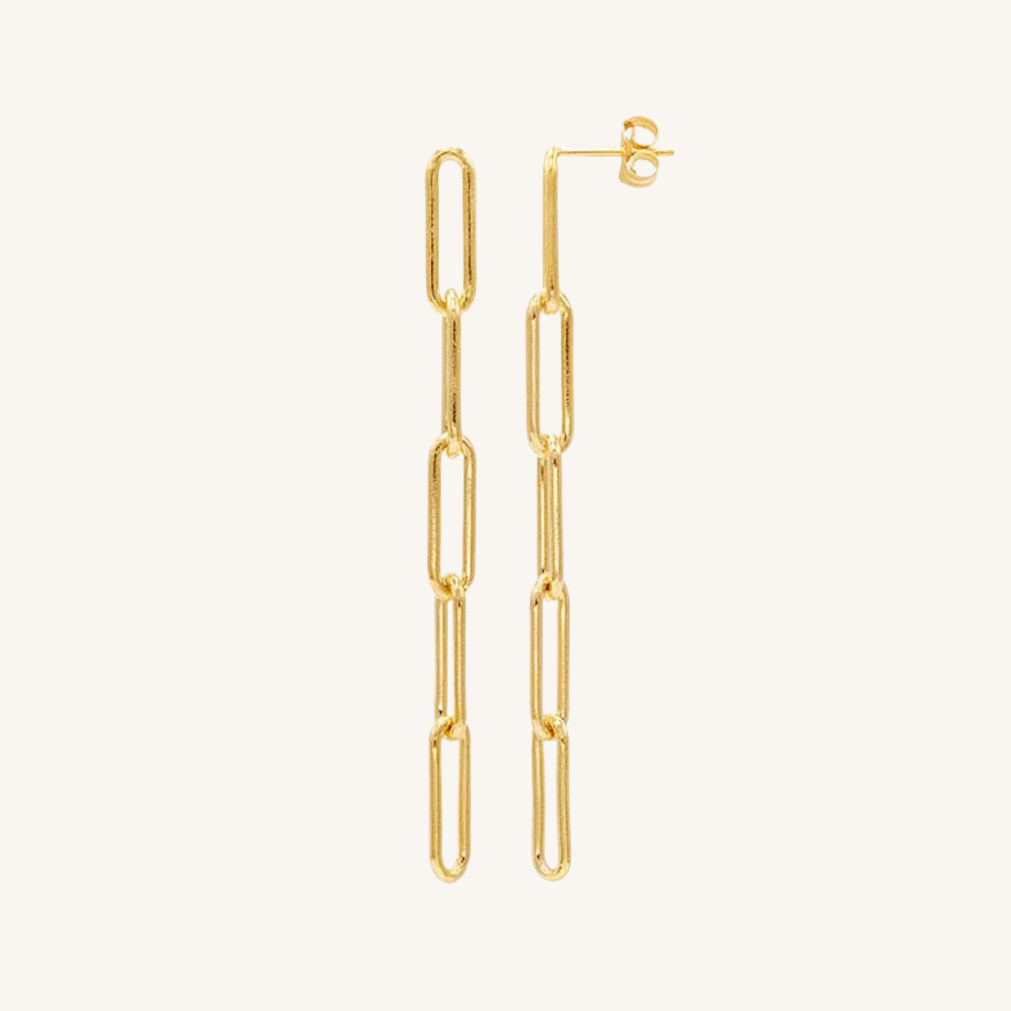 A pair of gold paperclip chain drop earrings with post-back closures, shown against a solid off-white background.