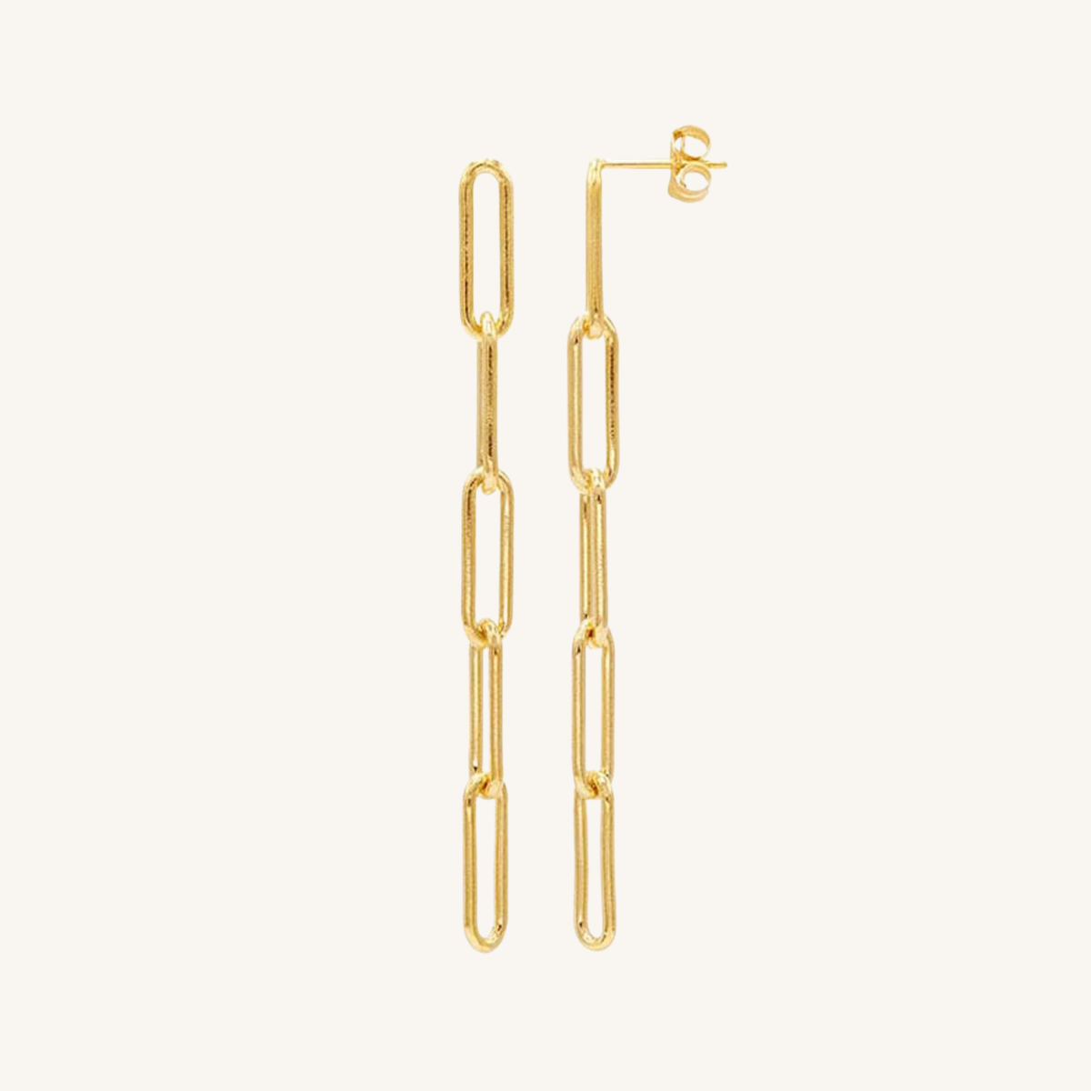 A pair of gold paperclip chain drop earrings with post-back closures, shown against a solid off-white background.