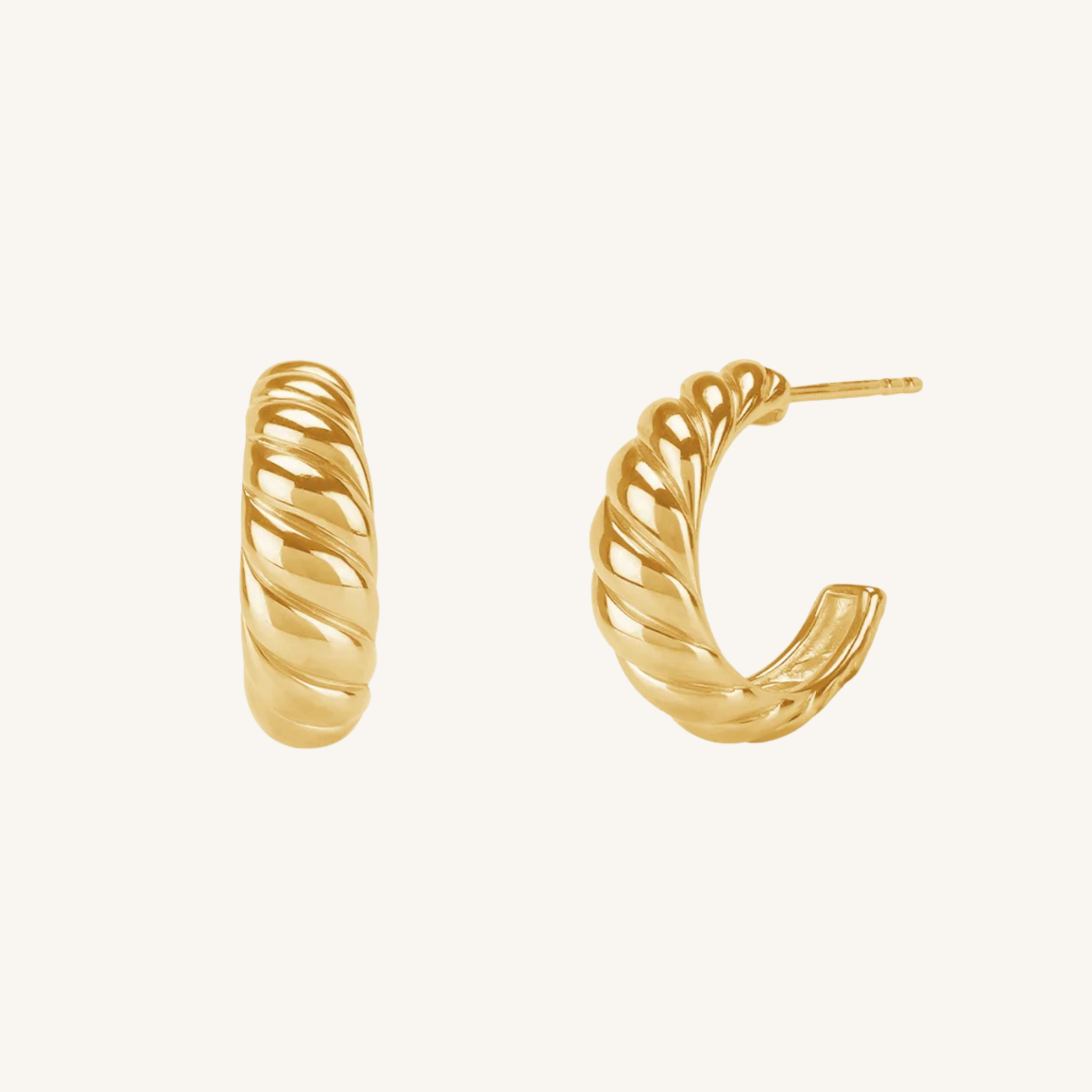 A pair of gold twisted hoop earrings with a textured, rope-like spiral design, shown on a clean off-white background.