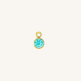 Round Aquamarine charm in gold.