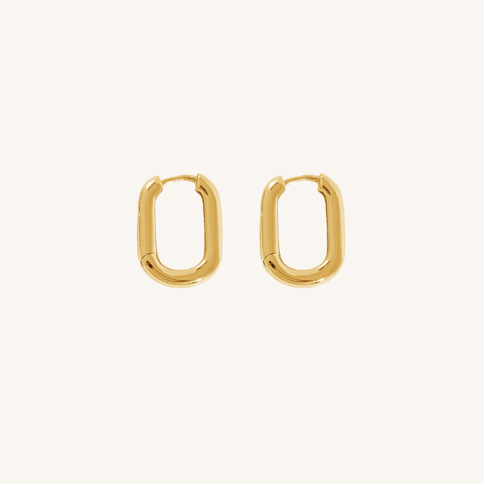 Gold hoop earrings on a white background