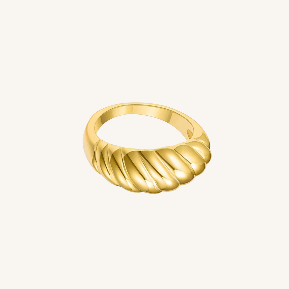 Gold ring with a textured design on a white background
