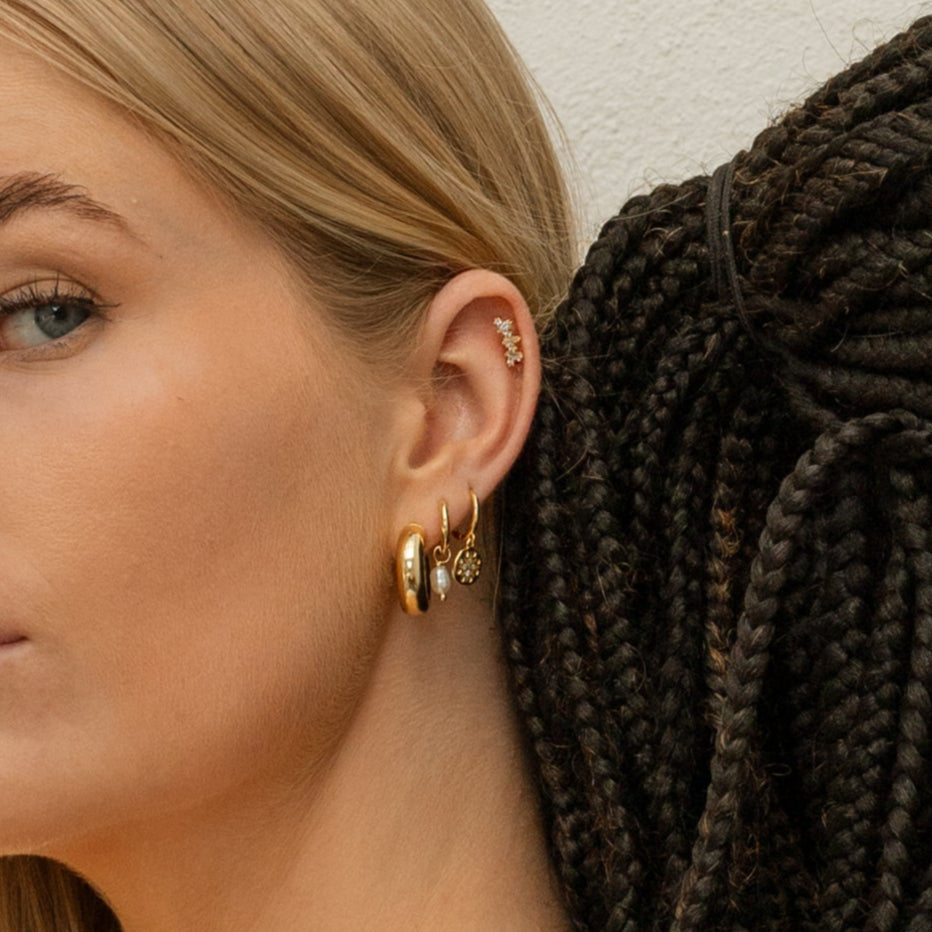 Romance Hoops in Gold shown on a model.