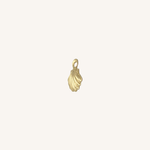 A small gold shell-shaped charm with a loop at the top, centered on a plain off-white background.