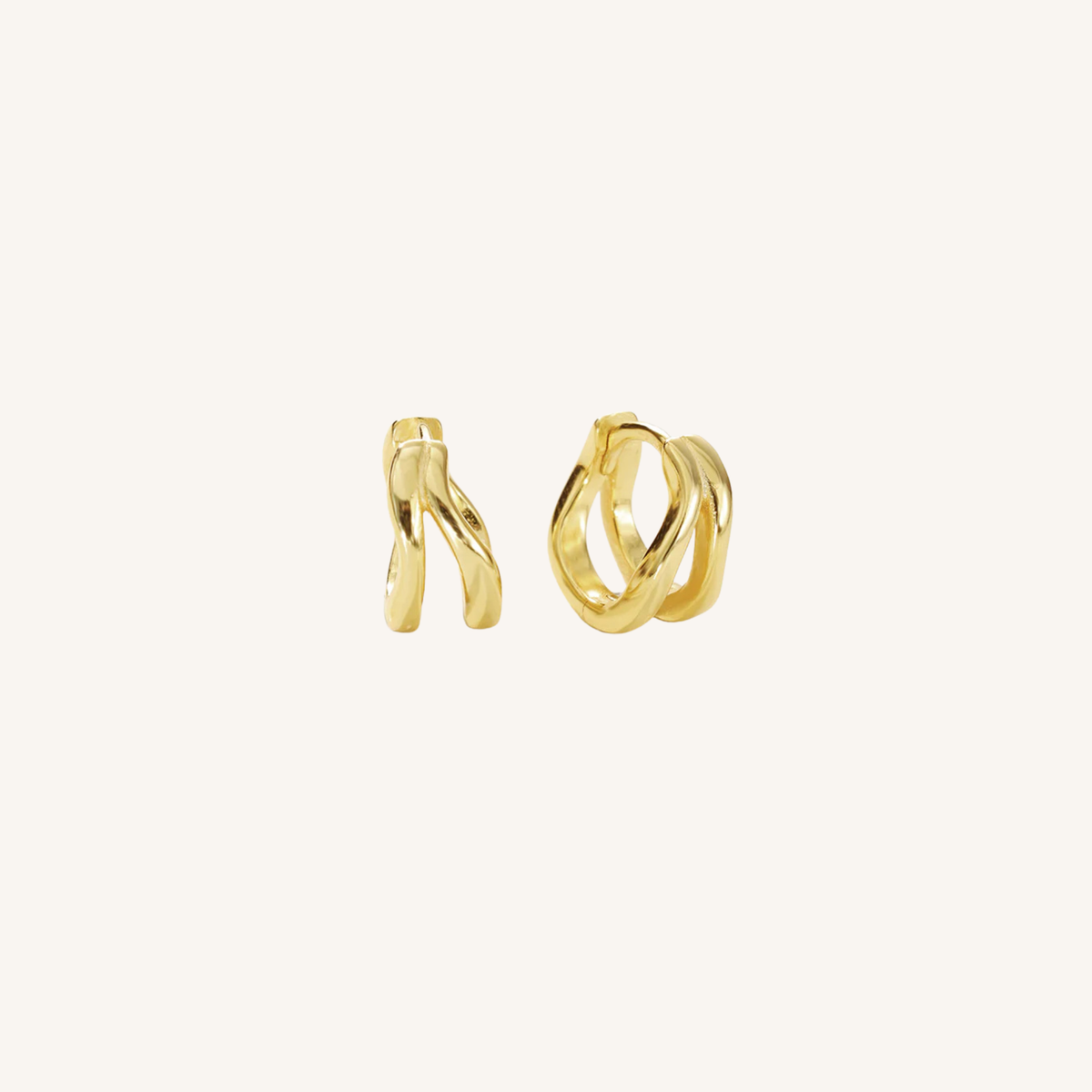 Gold hoop earrings on a white background