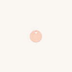 A small round rose gold disc charm with a hole at the top, centered on a plain off-white background.