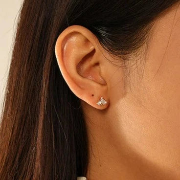 Model wearing Star Dust Barbell Earring in Gold.