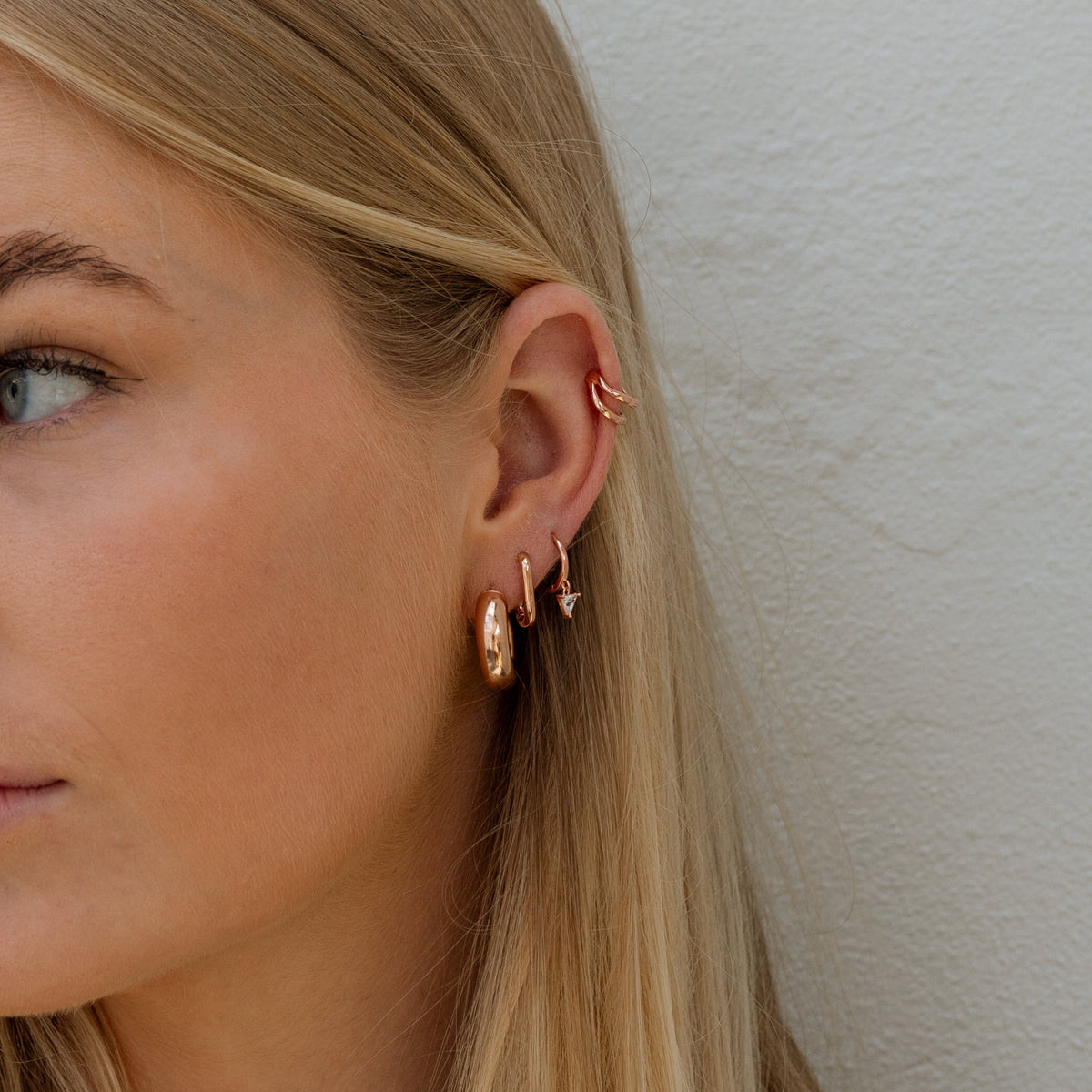Tierney Earrings in Rose Gold on model