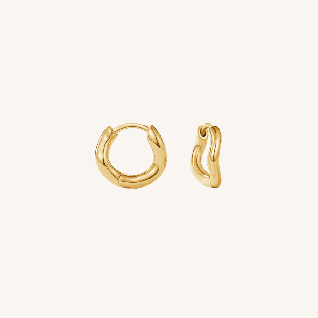 Gold hoop earrings on a white background
