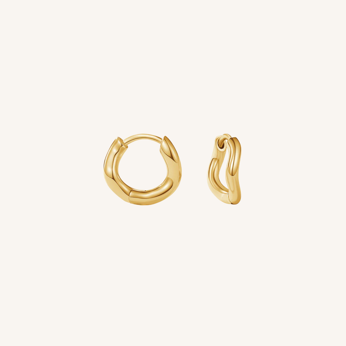 Gold hoop earrings on a white background
