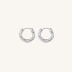 Pair of silver hoop earrings on a white background