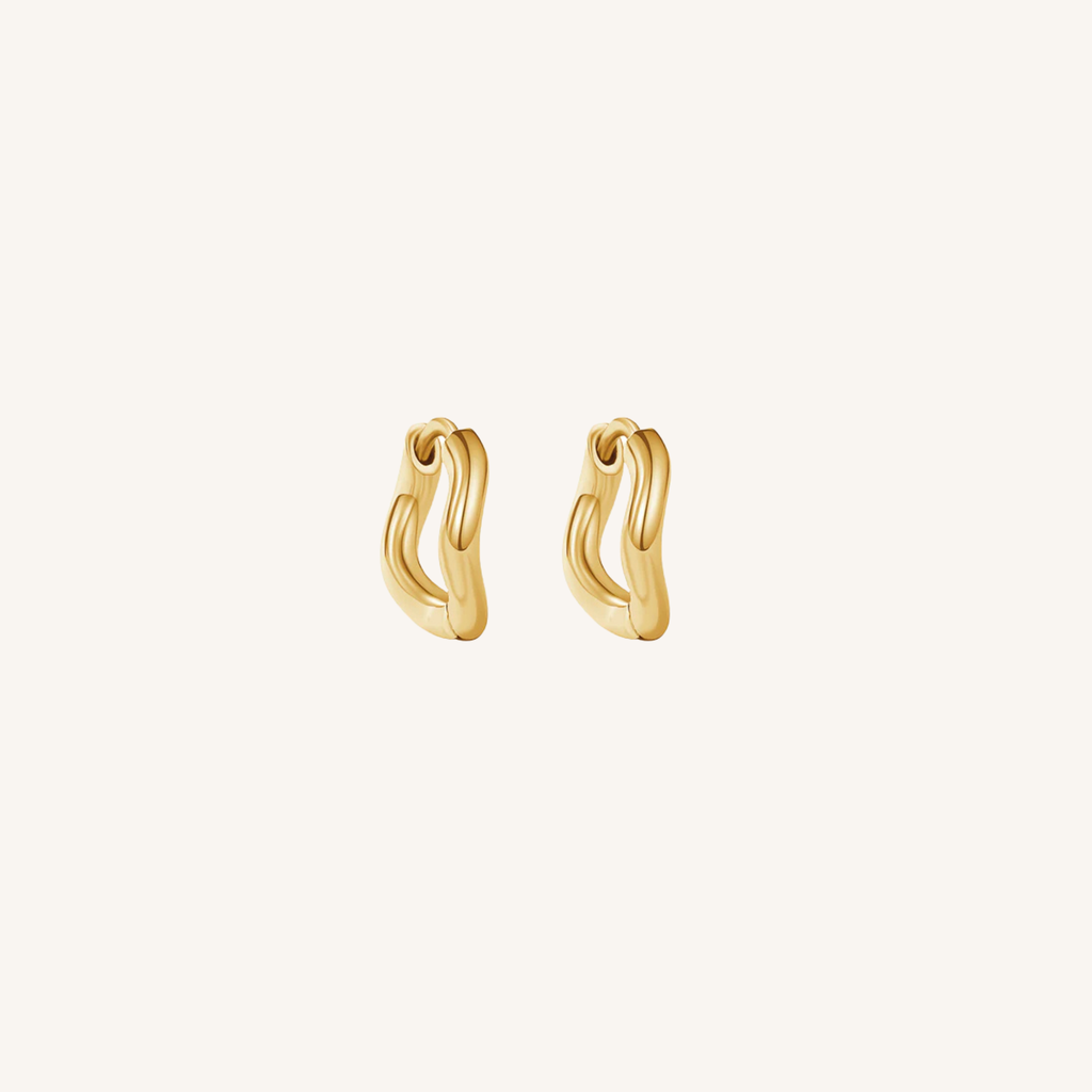 Gold hoop earrings on a white background