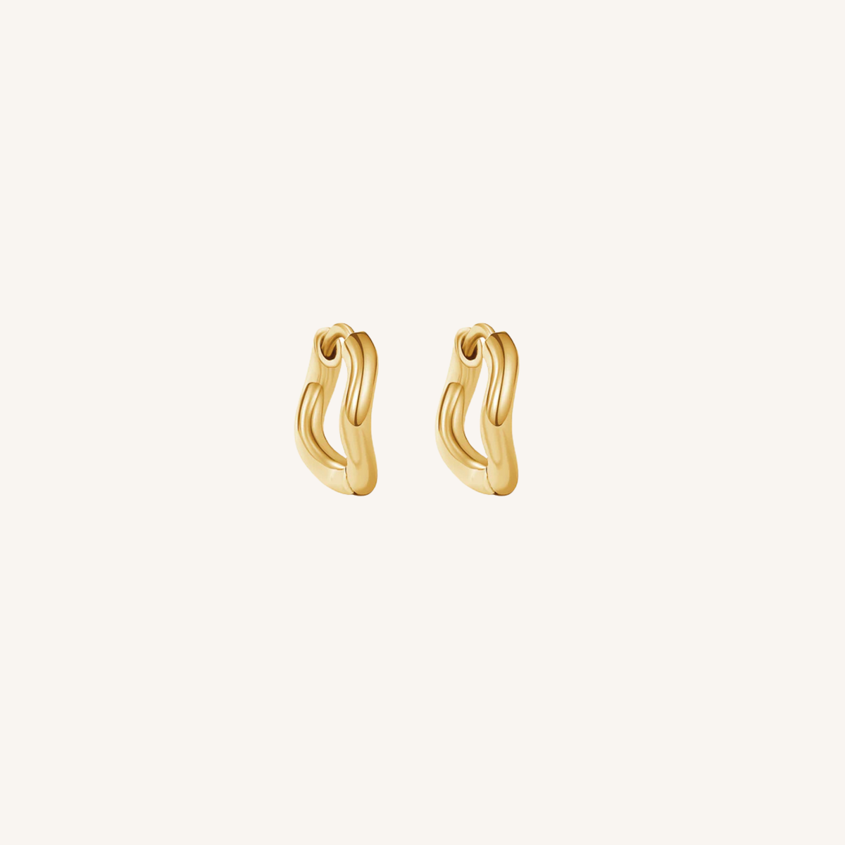 Gold hoop earrings on a white background