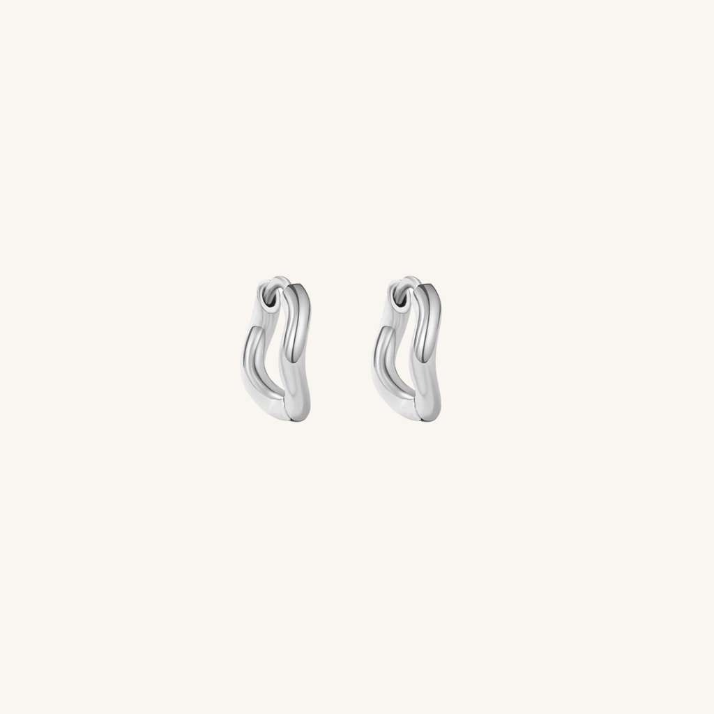 Pair of silver hoop earrings on a white background