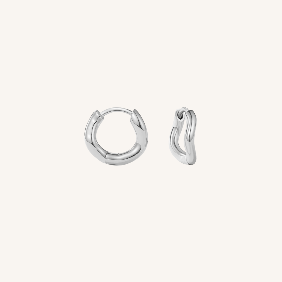 Pair of silver hoop earrings on a white background