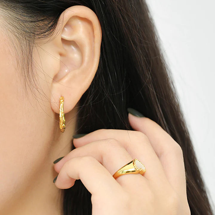 WithLoveHoopedEarrings- model wearing the gold earrings