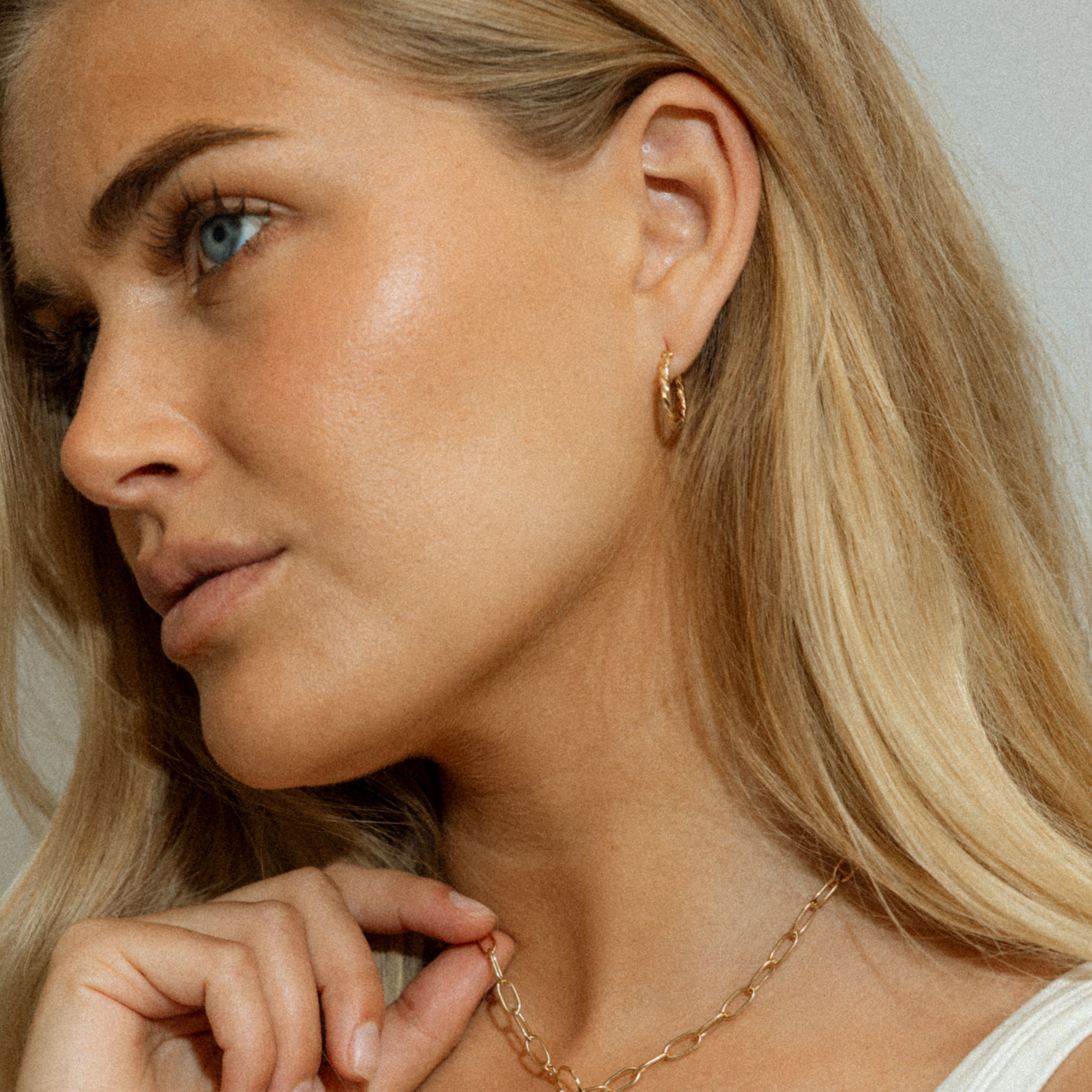 twisted hoop earrings in gold 