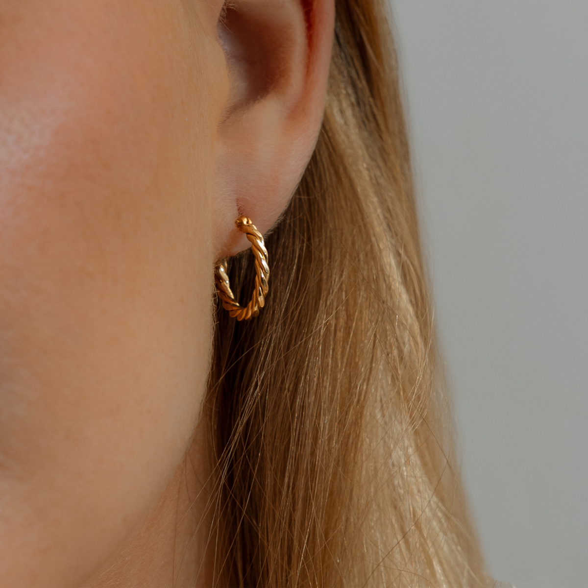 gold earrings with a twist. hooped earrings 