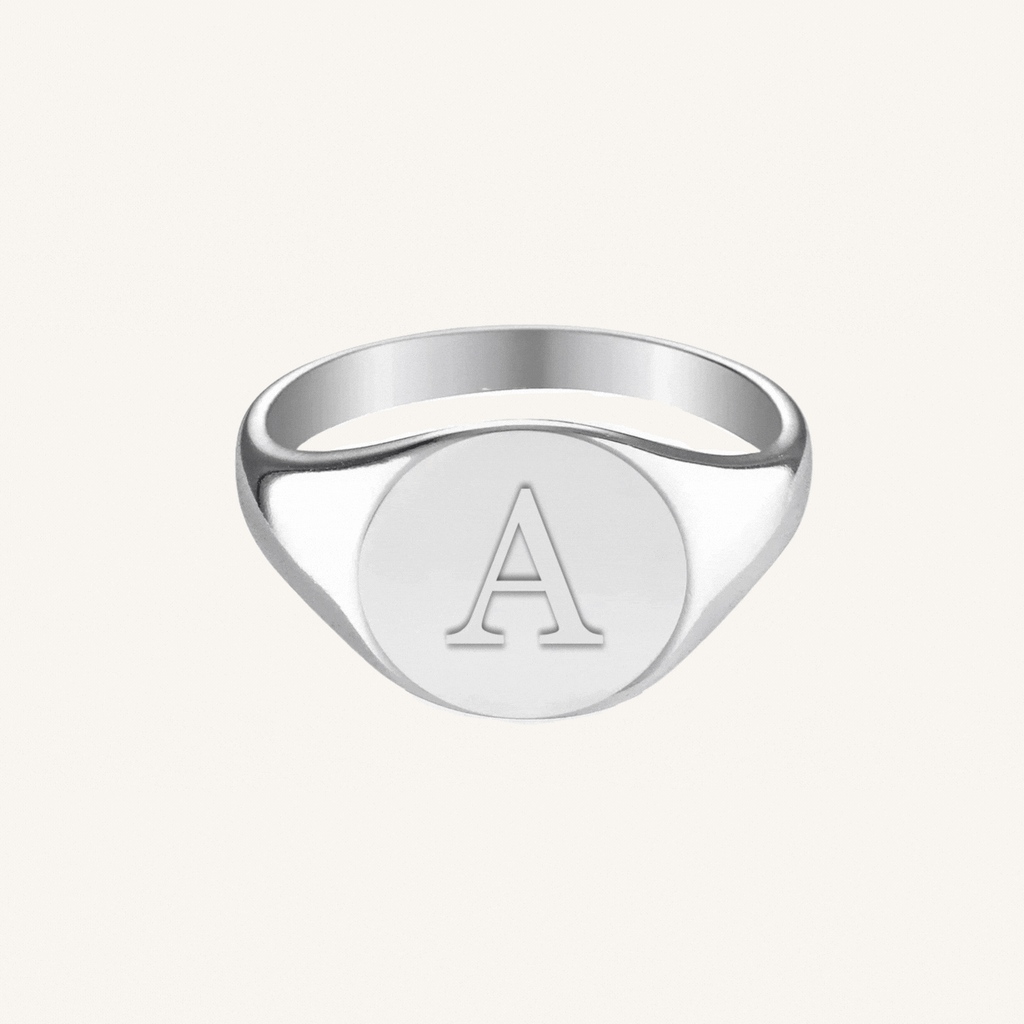 Signature Signet Ring in sterling silver, angled view showing the engravable oval face